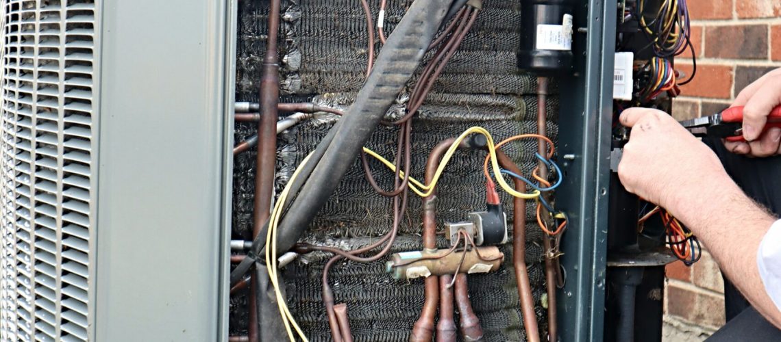 service-repair-being-done-on-a-heat-pump-hvac-syst-2021-08-29-01-18-52-utc